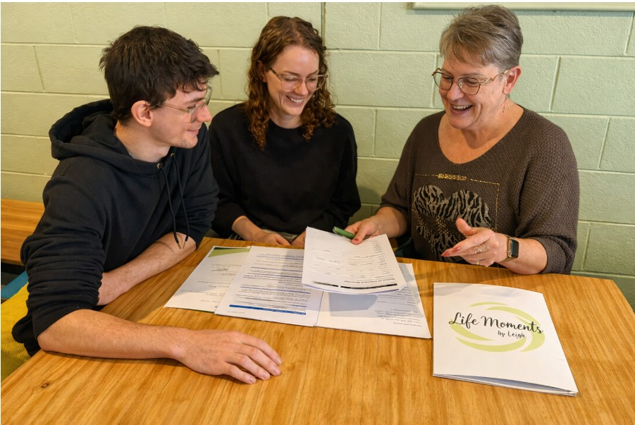 Leigh Mazzer with clients completing their first wedding paperwork appointment